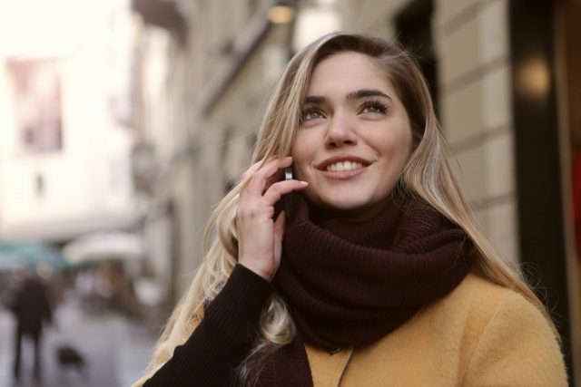 A Russian woman speaks confidently over the phone