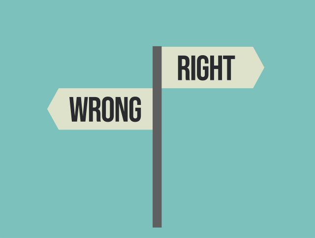 A sign post shows right and wrong 