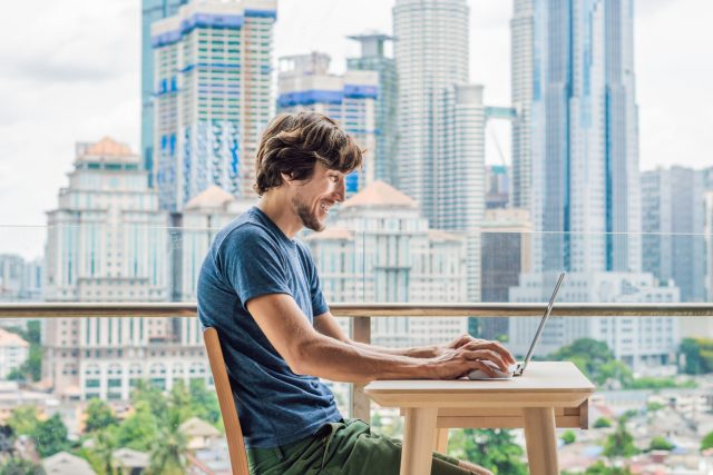 A man greets his accent coach on video chat.