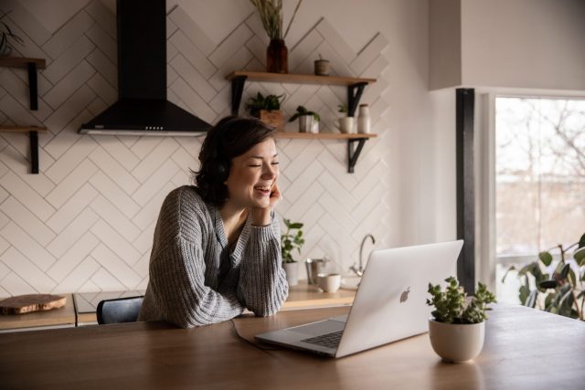 A woman joins from her kitchen