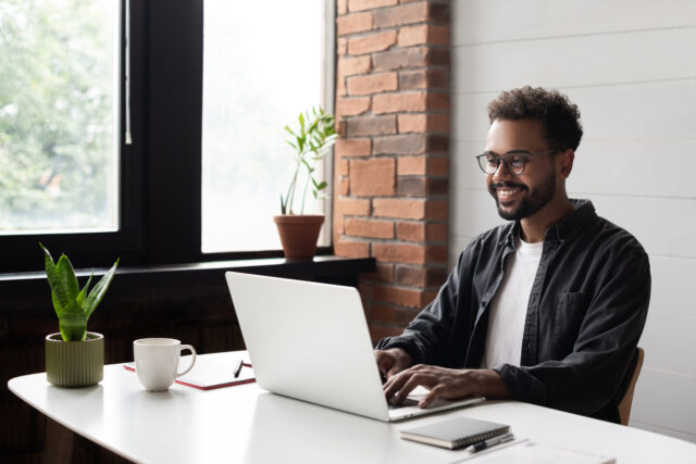 A young man is happy to find accent training online.