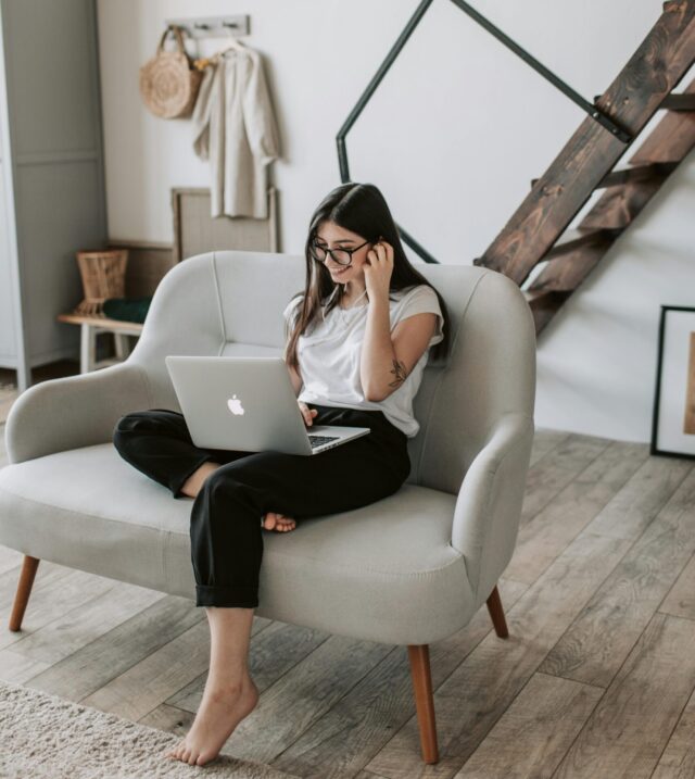 A young woman connects with her laptop