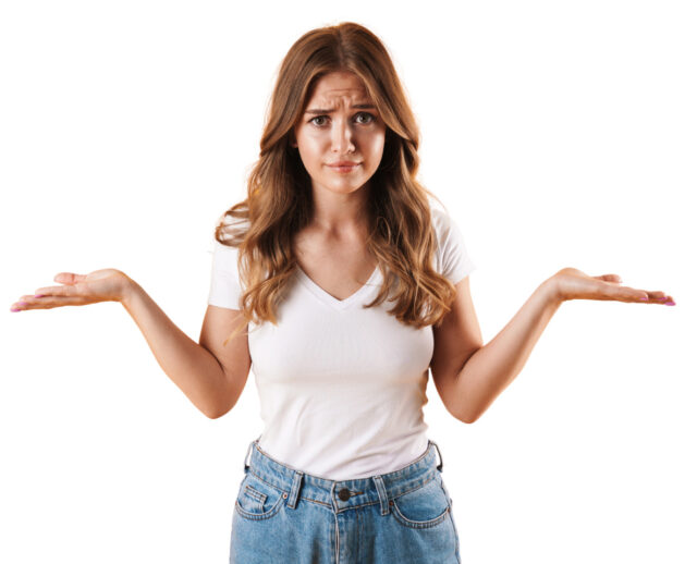 Woman expresses frustration with a shrug and confused face. 