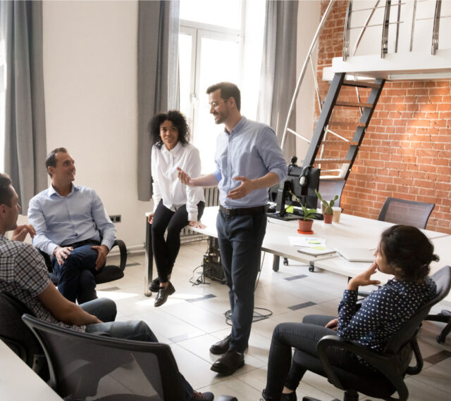 An animated team meeting goes well under the lead of a skilled speaker
