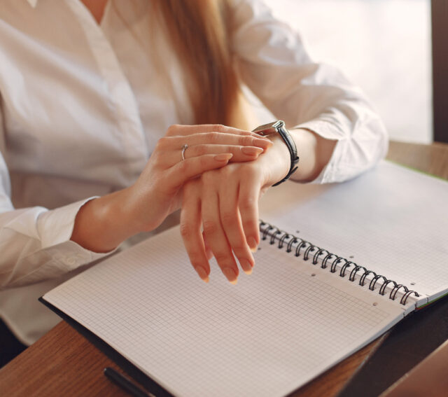 A woman checks her watch