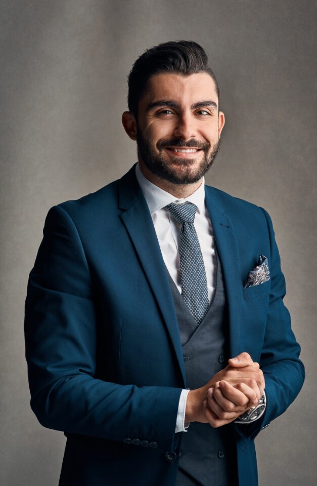 A business professional is dressed up and ready to make a presentation